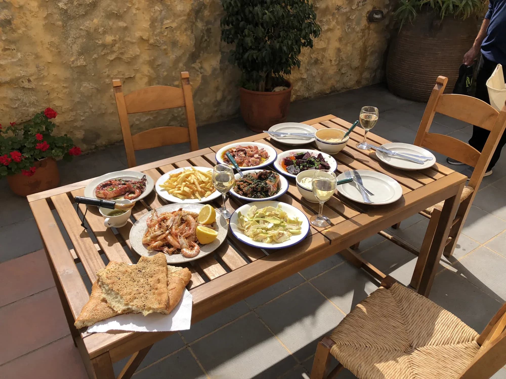 Traditional Cretan meal on the courtyard dining table