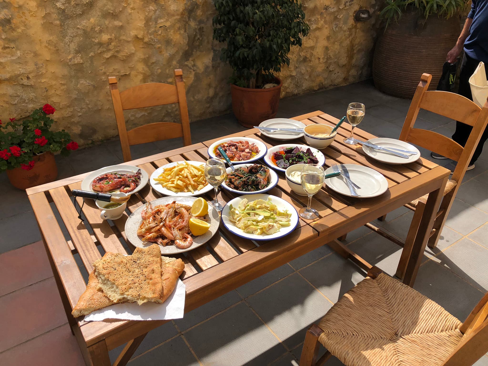 Traditional Cretan meal on the courtyard dining table